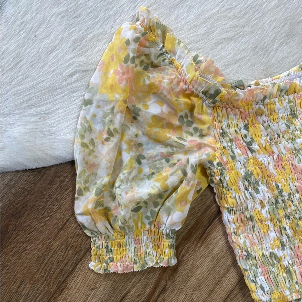 Astr the label yellow floral smocked crop top with puff sleeves.
